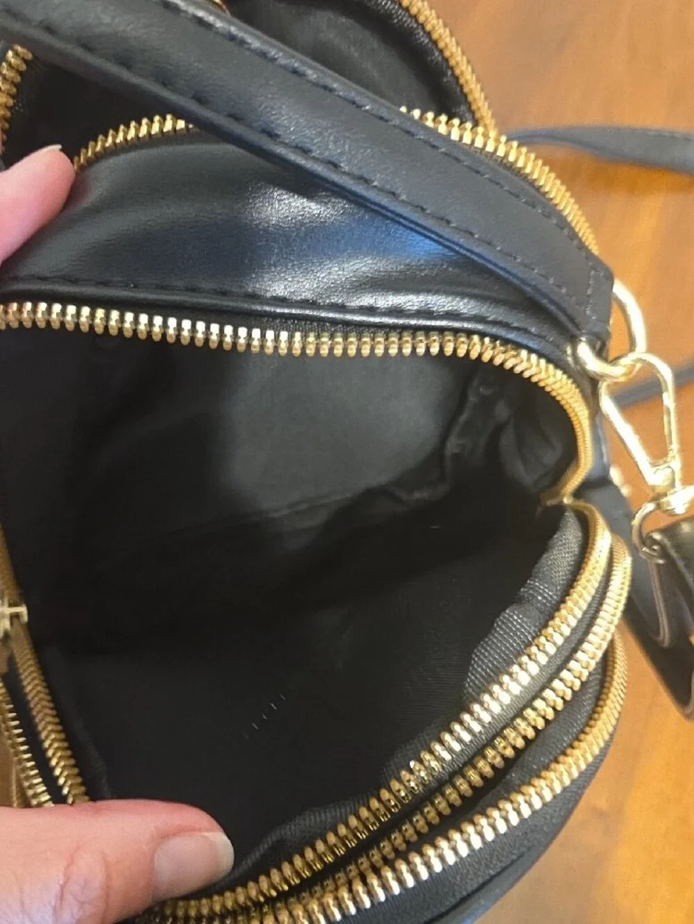 Black Crossbody Bag with Gold Bee Emblem